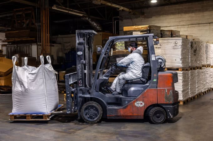 Operations forklift bulk bag loading.